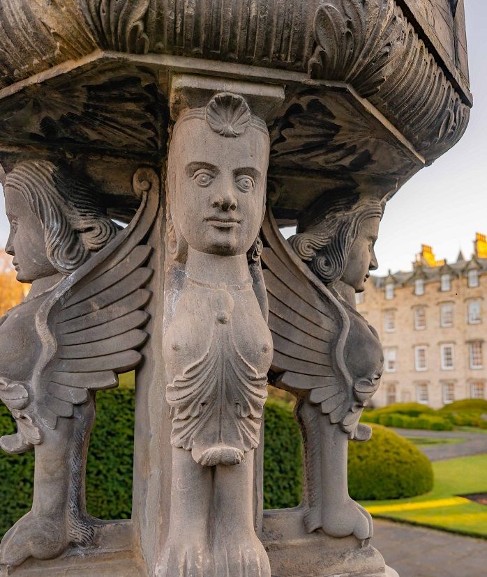 Close up of figurines on medieval Garden statue